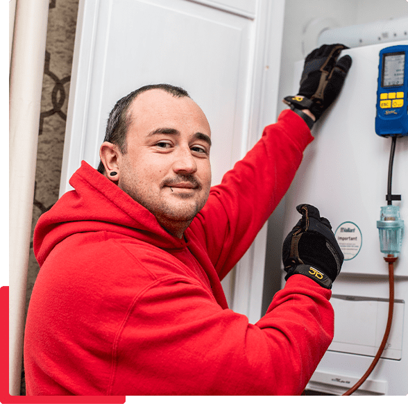 A gas safe plumber inspecting a boiler in a Sheffield home